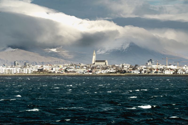 Reykjavík and Hallgrímskirkja across the bay under heavy cloud